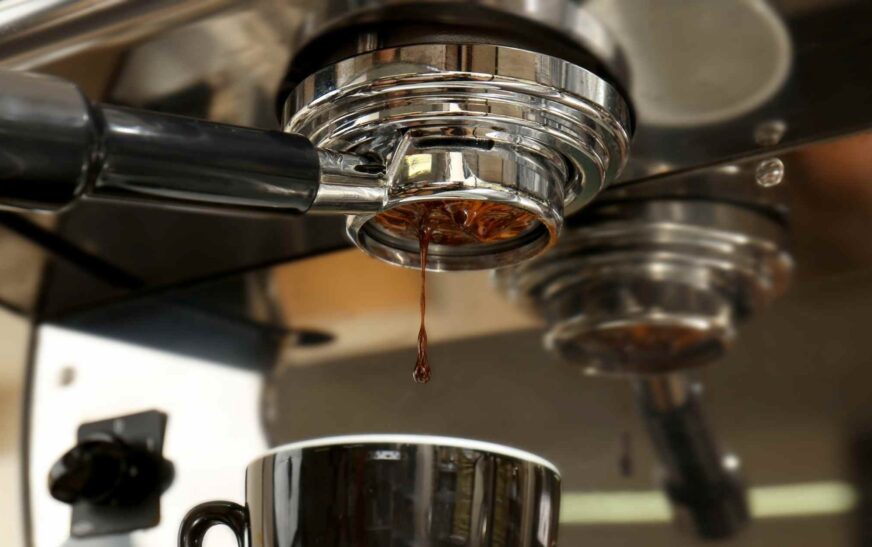 Espresso channeling seen through a bottomless portafilter with uneven water flow